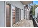 A cozy balcony featuring sliding glass doors, tile flooring and decorative iron work on the railing at 3649 Peachtree Ne Rd # 201, Atlanta, GA 30319