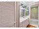 Bathroom with a white vanity, large mirrors, and tile floors at 3649 Peachtree Ne Rd # 201, Atlanta, GA 30319