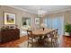 Elegant dining room features a chandelier, wood floors, and neutral color scheme at 3649 Peachtree Ne Rd # 201, Atlanta, GA 30319