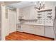 Charming kitchen features white cabinets, wood floors, and an oven at 3649 Peachtree Ne Rd # 201, Atlanta, GA 30319