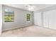 Bedroom featuring two large windows, double closet and neutral walls at 1023 Chartley Sw Dr, Lilburn, GA 30047