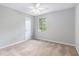 Bedroom featuring neutral walls, carpet, ceiling fan, and a window bringing in lots of natural light at 1023 Chartley Sw Dr, Lilburn, GA 30047
