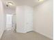 Bedroom with neutral carpet and access to additional rooms at 1266 Creekside Se Ter, Smyrna, GA 30082