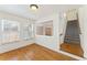Bonus room with hardwood floors, natural light, and access to the staircase at 1266 Creekside Se Ter, Smyrna, GA 30082