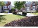 Beautiful community green space with mature trees, seating and manicured shrubs at 1266 Creekside Se Ter, Smyrna, GA 30082