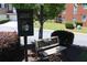 A community 'Free Public Library' box sits near a bench for relaxing with a new book at 1266 Creekside Se Ter, Smyrna, GA 30082