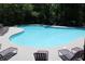 Large community swimming pool surrounded by lounge chairs and lush greenery at 1266 Creekside Se Ter, Smyrna, GA 30082