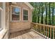 Outdoor deck features wood flooring, wood railing and overlooks green trees at 1266 Creekside Se Ter, Smyrna, GA 30082
