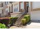 Townhome showcasing brick and stone exterior, manicured landscaping, and convenient access to the attached garage at 1266 Creekside Se Ter, Smyrna, GA 30082