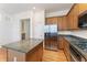 Modern kitchen features stainless steel appliances, granite counters, wooden cabinets and island at 1266 Creekside Se Ter, Smyrna, GA 30082
