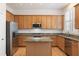 Well-equipped kitchen featuring stainless steel appliances, granite countertops, and ample cabinet space. Large window at 1266 Creekside Se Ter, Smyrna, GA 30082
