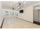 Bright living area with tile floors, modern lighting, a TV, and ample space for relaxing or entertaining at 1266 Creekside Se Ter, Smyrna, GA 30082