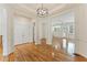 Spacious open-concept living room boasts hardwood floors and an abundance of natural light. Decorative lighting featured at 1266 Creekside Se Ter, Smyrna, GA 30082