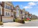 Charming townhomes feature well-maintained landscaping, brick exteriors, and attached garages at 1266 Creekside Se Ter, Smyrna, GA 30082