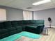 Basement features hardwood floors and a plush sofa, creating a cozy area at 4701 Flat Shoals Rd # 37E, Union City, GA 30291