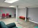 Finished basement with gray floors and walls, perfect for extra living space or recreation at 4701 Flat Shoals Rd # 37E, Union City, GA 30291