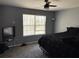 Bedroom with a large bed, neutral walls, and a window with natural light at 4701 Flat Shoals Rd # 37E, Union City, GA 30291