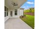 Covered back porch with ceiling fan, perfect for enjoying the outdoors at 1101 Cooks Farm Way, Woodstock, GA 30189