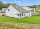 Backyard features a covered patio and well-maintained lawn, perfect for outdoor living at 1101 Cooks Farm Way, Woodstock, GA 30189