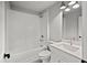 Bathroom features a tub shower combo, white subway tiles, and white cabinets at 1101 Cooks Farm Way, Woodstock, GA 30189