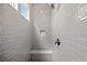 Beautiful walk-in shower features gray subway tiles, a bench, and a shower niche at 1101 Cooks Farm Way, Woodstock, GA 30189