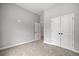 Bedroom with plush carpeting, neutral walls, and closet at 1101 Cooks Farm Way, Woodstock, GA 30189