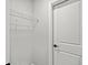 Walk-in closet featuring white wire shelving and a white door at 1101 Cooks Farm Way, Woodstock, GA 30189