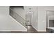 Home features a staircase with wood and iron handrails and an entryway view of a laundry room at 1101 Cooks Farm Way, Woodstock, GA 30189