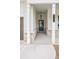 Welcoming front porch with columns, stylish lighting, and a decorative front door at 1101 Cooks Farm Way, Woodstock, GA 30189