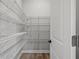 Walk-in pantry with wire shelving for organized storage at 1101 Cooks Farm Way, Woodstock, GA 30189