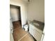 Bathroom featuring a toilet, vanity with granite countertop, and access to closet at 11620 E Lovejoy Rd, Hampton, GA 30228