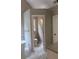 Bathroom featuring marble-style tile, a separate toilet room, and modern fixtures for a luxurious feel at 1200 Larson Sw Ln, Marietta, GA 30064