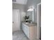 Bathroom vanity featuring granite countertops, modern lighting, and attractive white cabinets at 1200 Larson Sw Ln, Marietta, GA 30064