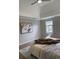 Comfortable bedroom with a ceiling fan and neutral tones, creating a cozy and inviting space at 1200 Larson Sw Ln, Marietta, GA 30064