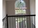 Welcoming foyer with a decorative chandelier and staircase with dark railings, offering a bright entry at 1200 Larson Sw Ln, Marietta, GA 30064