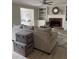 Bright living room with fireplace, built-in shelving, and comfortable seating perfect for entertaining at 1200 Larson Sw Ln, Marietta, GA 30064