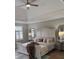 Elegant main bedroom with a tray ceiling, ceiling fan, and a large window to give natural light at 1200 Larson Sw Ln, Marietta, GA 30064