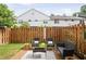Cozy backyard area with a wooden fence and comfortable outdoor seating at 136 Peachtree Memorial Nw Dr # Nj2, Atlanta, GA 30309