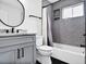 Modern bathroom featuring gray subway tile, black fixtures, and a stylish vanity at 136 Peachtree Memorial Nw Dr # Nj2, Atlanta, GA 30309