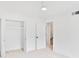 Bedroom with walk-in closet, neutral carpet, and white walls and trim at 136 Peachtree Memorial Nw Dr # Nj2, Atlanta, GA 30309