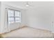 Bright bedroom with neutral carpet, white trim, and natural light from the large window at 136 Peachtree Memorial Nw Dr # Nj2, Atlanta, GA 30309