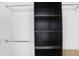 Walk-in closet features built-in shelving units and closet rod for storage at 136 Peachtree Memorial Nw Dr # Nj2, Atlanta, GA 30309