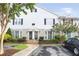 Charming townhouse with stone accents, bay windows, and well-maintained landscaping at 136 Peachtree Memorial Nw Dr # Nj2, Atlanta, GA 30309