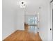 Elegant hallway featuring hardwood floors and a view into a living room with a bay window at 136 Peachtree Memorial Nw Dr # Nj2, Atlanta, GA 30309