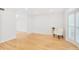 Bright, airy living room with hardwood floors, white walls, and a shuttered bay window at 136 Peachtree Memorial Nw Dr # Nj2, Atlanta, GA 30309