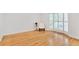 Serene living room featuring hardwood floors, bay window with shutters and a modern chair at 136 Peachtree Memorial Nw Dr # Nj2, Atlanta, GA 30309