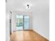 Bright room with hardwood floors and sliding glass doors leading to an outdoor space at 136 Peachtree Memorial Nw Dr # Nj2, Atlanta, GA 30309