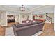 Expansive finished basement area with a lounge and custom bar, perfect for entertaining at 1477 Edenham Ln, Cumming, GA 30041