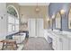 Luxurious bathroom with double vanity, standalone tub, glass shower and decorative tile flooring at 1477 Edenham Ln, Cumming, GA 30041