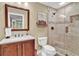 Bathroom with tiled shower, and vanity with ample counter space. Modern fixtures enhance the elegant design at 1477 Edenham Ln, Cumming, GA 30041